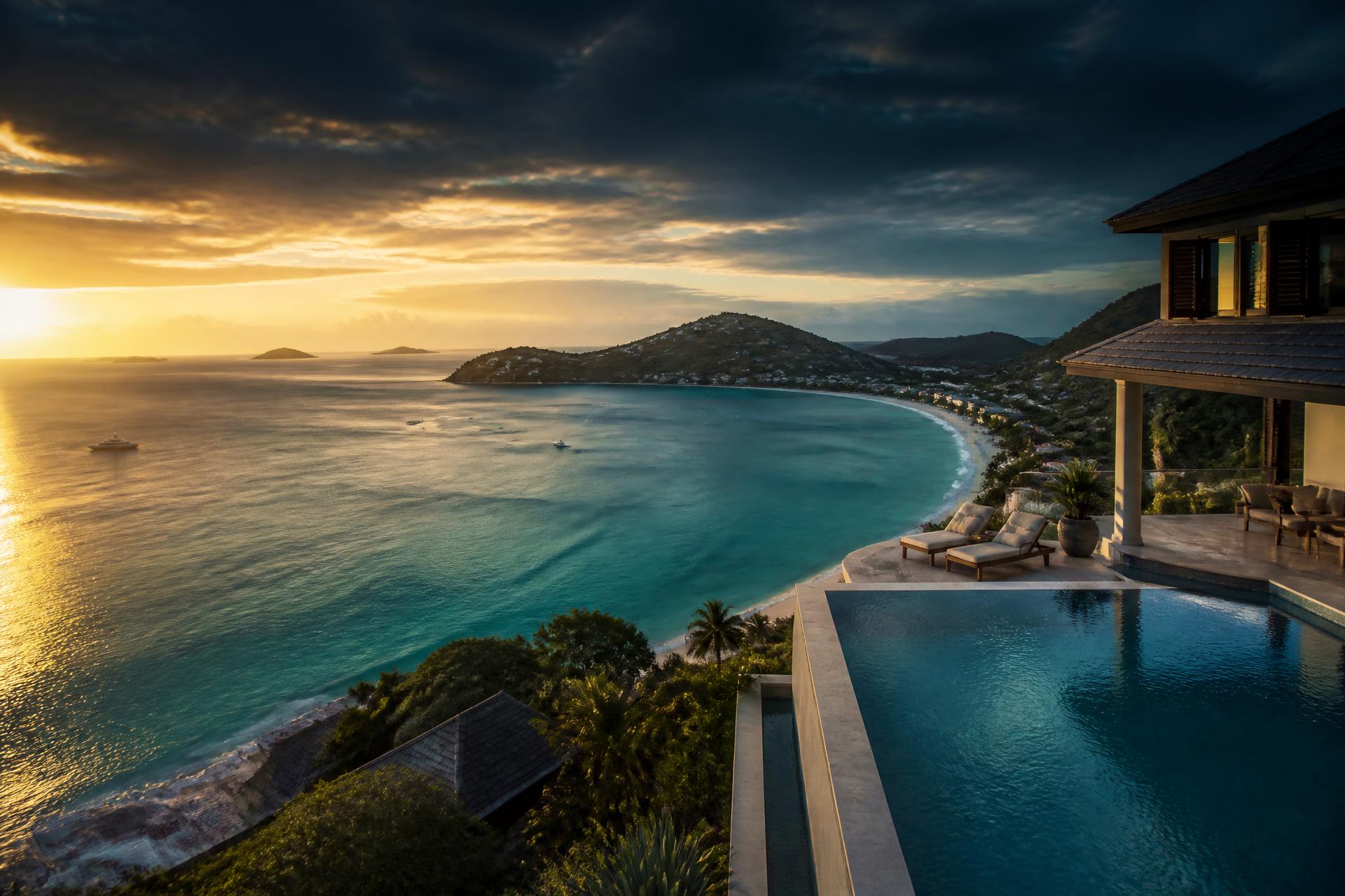 Aerial view of a St. Maarten beach and turquoise water at golden hour